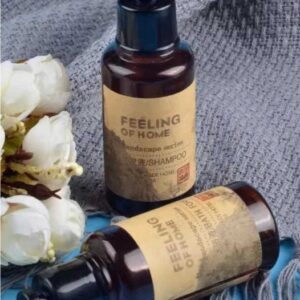 Amber toiletry bottles on grey linen