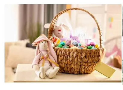 Braided basket with tall handle shown with Easter gifts - HNH 29037